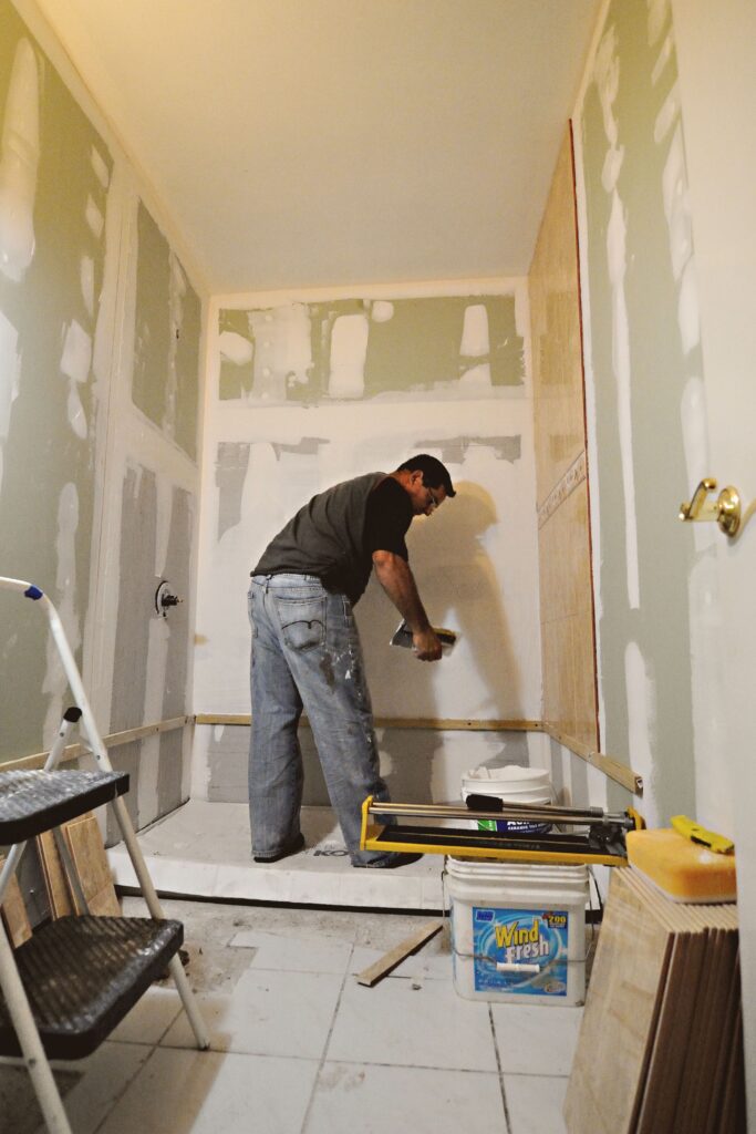 Bathroom Remodel Contractors: 7 Best Secrets to Hire Pros bathroom remodel contractors installing custom shower tile wall